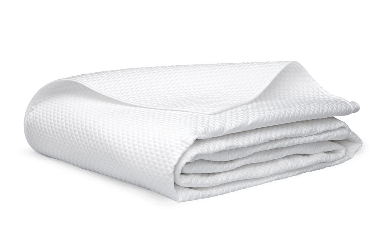 A neatly folded Alba Bedding Collection blanket or towel in white by Matouk, crafted from Egyptian cotton sateen and OEKO-TEX® Standard 100 certified, is placed on a flat surface.