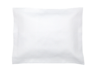 A sealed white square packet with a textured surface, photographed against a plain white background, evokes the luxurious feel of Matouk's Alba Bedding Collection in White.