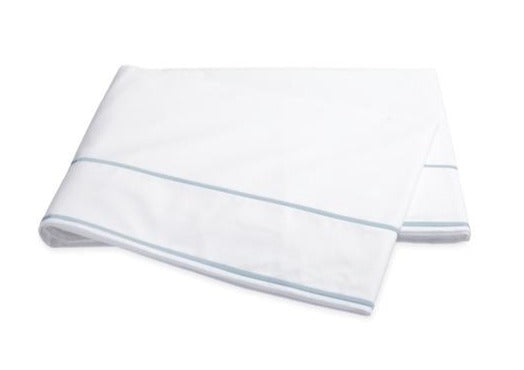 Two folded Matouk Ansonia Bedding Collection, Blue towels, OEKO-TEX Standard 100 certified, isolated on a white background.