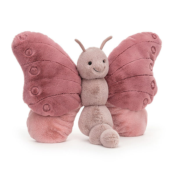 Beatrice Butterfly, a pink butterfly stuffed toy by Jellycat designs, on a white background.