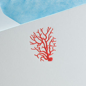 The Coral Card Set by Printery features a bright white card with a red poppy coral illustration, shown with its azure blue envelope flap at the top.