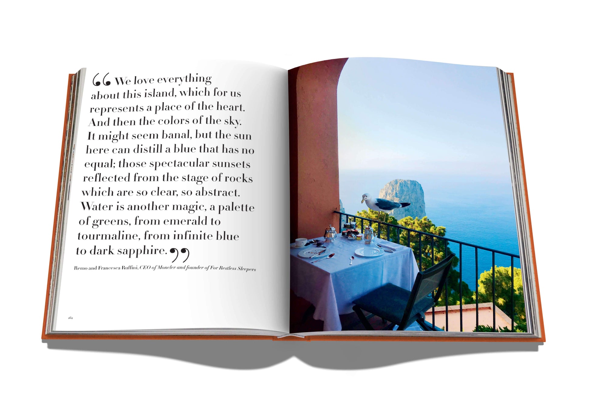 Open book displaying a travel article with a picturesque view of Capri's coastal landscape from a balcony, embodying the Mediterranean spirit of Assouline's Capri Dolce Vita.