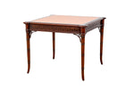 A small Kindel wooden table with a pink leather top featuring a Greek key design.