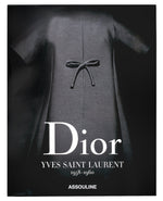 Cover of the book "Dior II by YSL" by Assouline, featuring a black haute couture dress with a bow.