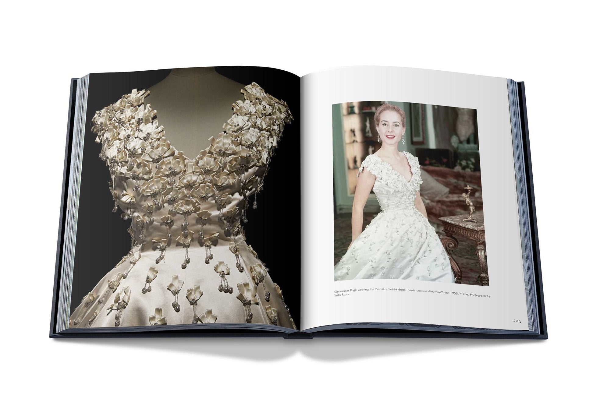 A book opened to pages featuring a close-up of an ornate, floral-embellished dress on the left and a photograph of a woman wearing a similar haute couture design by Dior I by Christian Dior on the right.