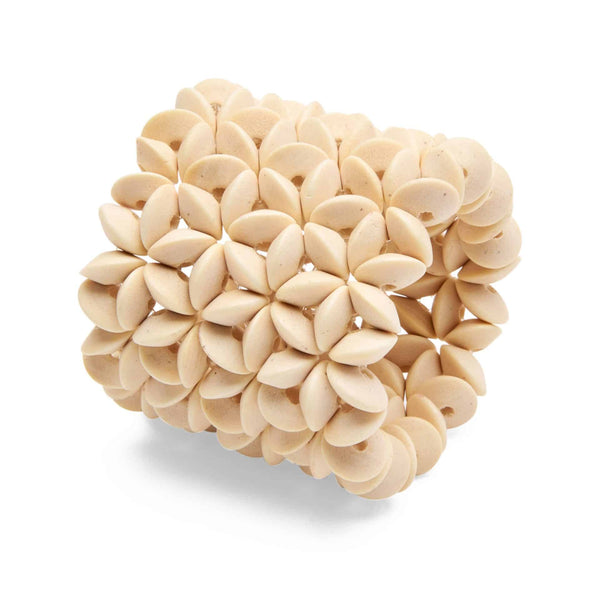 A Deborah Rhodes Floral Wood Cuff Napkin Ring, Set of 4 with a flower pattern on it.
