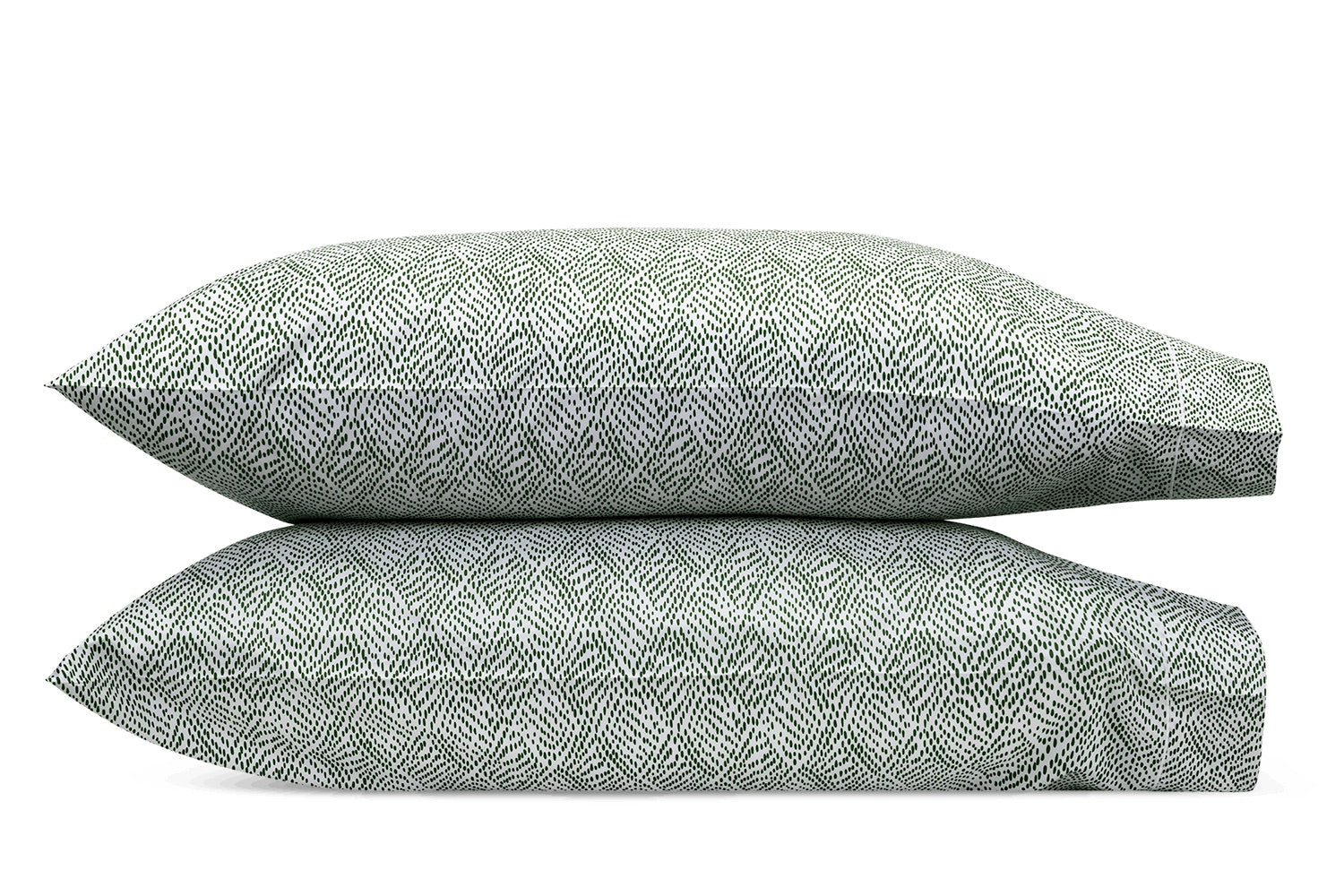 Two green and white Duma Diamond Bedding Collection pillows by Matouk, featuring a geometric pattern, are stacked against a white background.