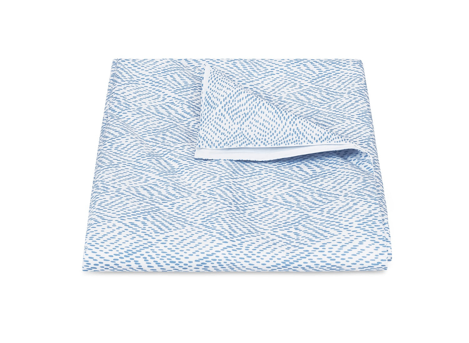 The Duma Diamond Bedding Collection in Sky by Matouk, made from OEKO-TEX® certified cotton, features a blue and white geometric pattern blanket neatly folded with one corner flipped on a white background.