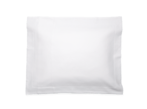 The Elliot Bedding Collection by Matouk is shown in white on a transparent background—an essential modern bedroom staple for keeping your space protected and organized.