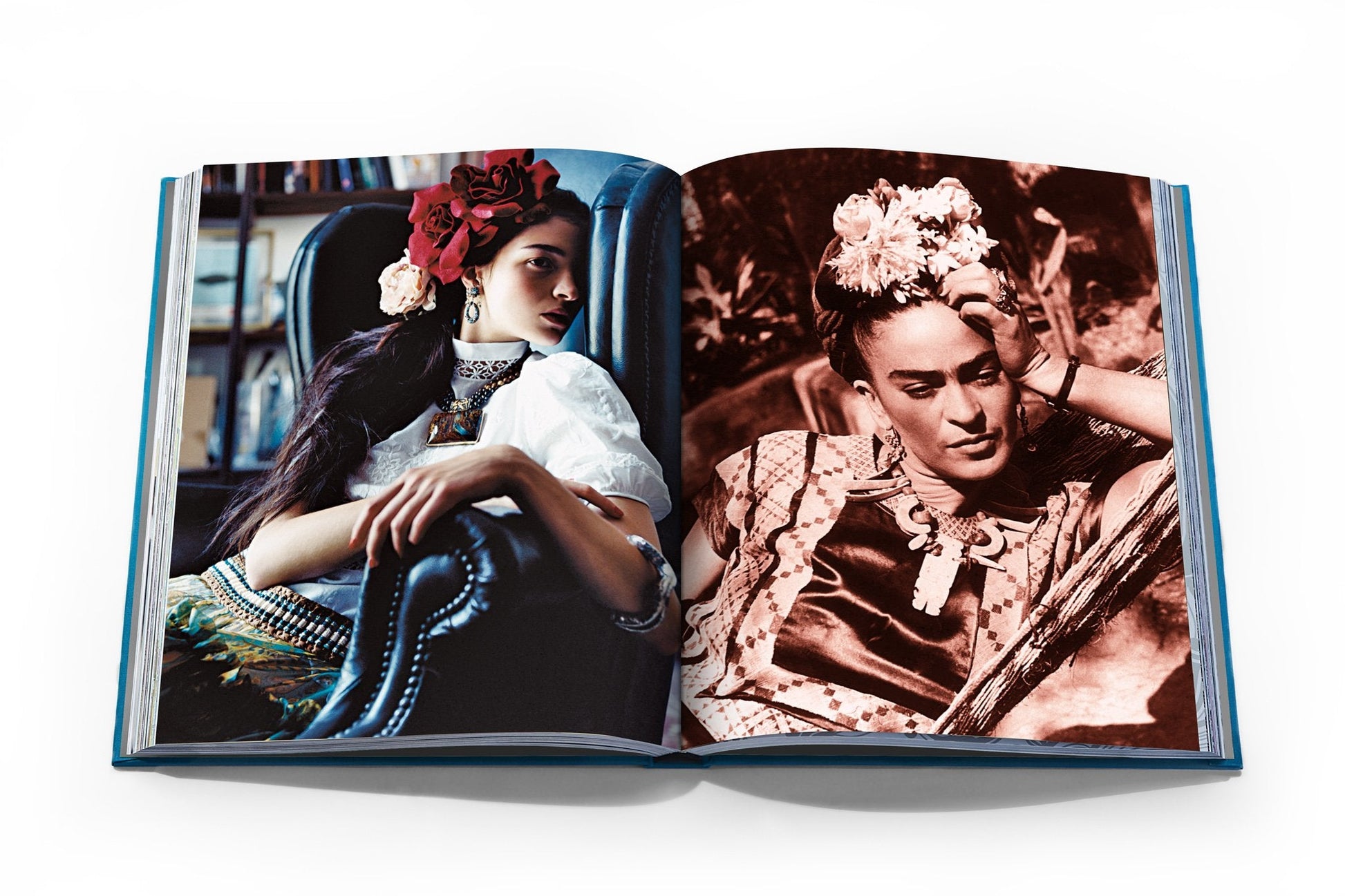 An open book from Assouline's "Frida Kahlo: Fashion As the Art of Being" reveals a captivating contrast: on one page, a woman sits in a chair, while on the other, a Frida Kahlo-inspired artist reclines with flowers in her hair, exuding timeless style.