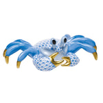 The Herend Ghost Crab, Blue features hand-painted blue and white scales, gold-colored claws and tips, and large eyes for an artistic touch against a white background.
