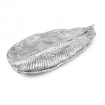 The Beatriz Ball Garden Jungle Leaf Platter is a silver aluminum alloy piece with detailed vein textures, offering an elegant decorative touch.
