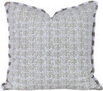 The Kalimba with Brush Fringe Outdoor Pillow by Hive Custom Pillows features a light beige geometric design with textured edges. This elegant, double-sided pillow adds style and versatility to any outdoor space.