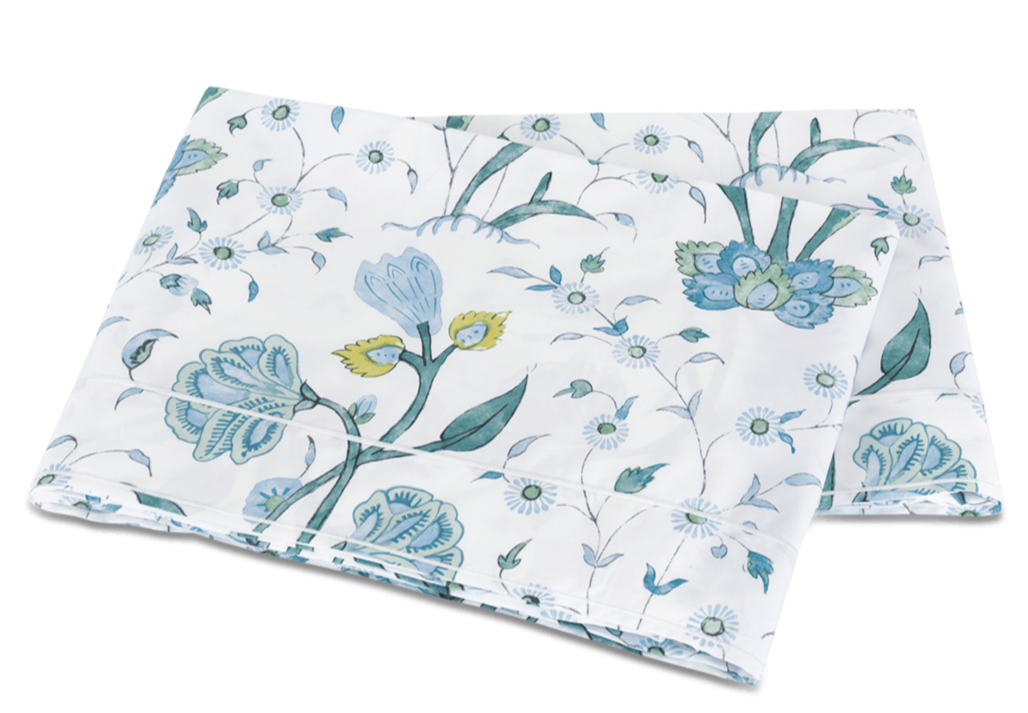 Floral patterned fabric from the Matouk Schumacher Bedding Collection, Khilana, folded neatly on a white background.