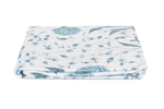 Folded fabric with a floral pattern on a plain background from the Matouk Schumacher Bedding Collection, Khilana.