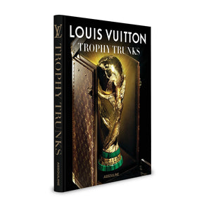 Louis Vuitton Trophy Trunks" by Assouline features the FIFA World Cup trophy in a Louis Vuitton trunk on its cover, highlighting luxury sports memorabilia artistry.