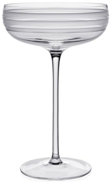 A clear William Yeoward Crystal Madison Coupe Glass showcasing a favorite champagne on a white background.