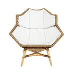 The McGuire Furniture Nozomu Lounge Chair, with its artistic vision and hand-woven rattan design, features a sleek white cushion for added comfort.