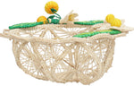 The Mini Orange Market Bread Basket by Mercedes Salazar features natural raffia with open sides, accented by yellow and green woven flowers and leaves on the rim for a charming touch.