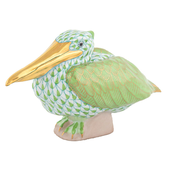 Decorative Herend Sitting Pelican porcelain figurine with hand-painted gold and Key Lime Green details.