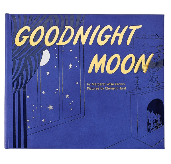 A blue and gold Graphic Image leather-bound cover of the children's book "Goodnight Moon" by Margaret Wise Brown, featuring stylized illustrations of a night sky and room.