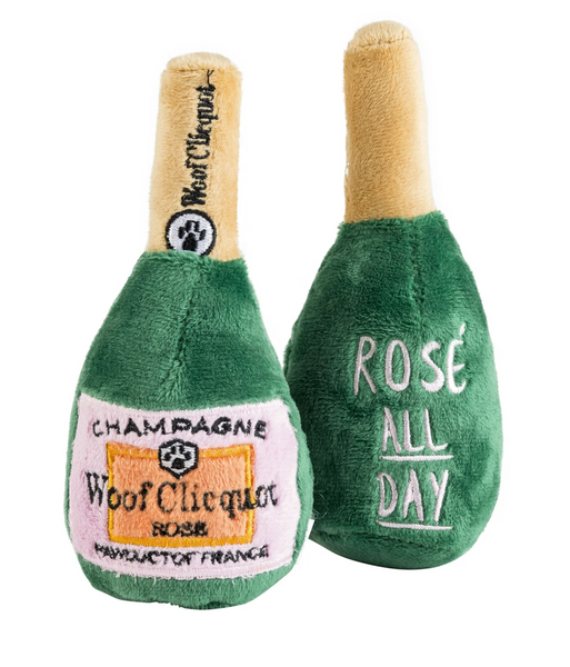 Two plush dog toys modeled after the Haute Diggity Dog Woof Clicquot Rose Champagne Bottle Dog Toy, Large with Haute Diggity Dog's pet-friendly branding.