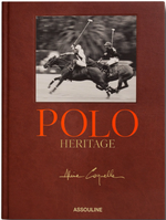Hardcover book titled "Assouline's Polo Heritage" with a black-and-white photo of two polo players on horses on historical polo grounds and an author's signature.
