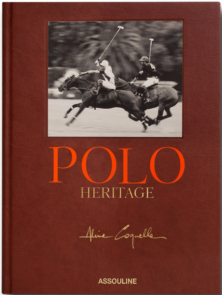 Hardcover book titled "Assouline's Polo Heritage" with a black-and-white photo of two polo players on horses on historical polo grounds and an author's signature.