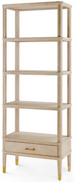 A tall, narrow wooden Bungalow5 Bertram Etagere, Cerused Oak with five open shelves and a drawer at the bottom, featuring golden feet.