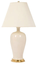 The Amy Lamp in Tea Stain with Gold Gilt by Christopher Spitzmiller features a white ceramic body, a brass cluster base, and a wide white vellum shade, shown against a plain background.