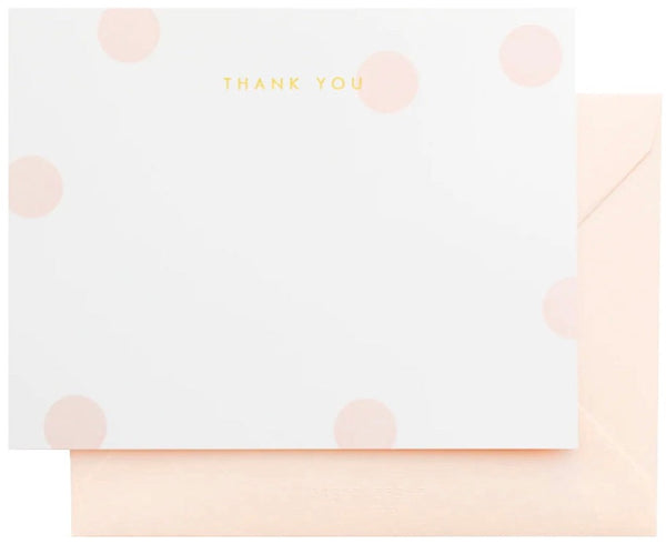 A thank-you card with a minimalist design featuring pink dots and a matching envelope, presented in a Sugar Paper Thank You Pink Dot Boxed Note Set.