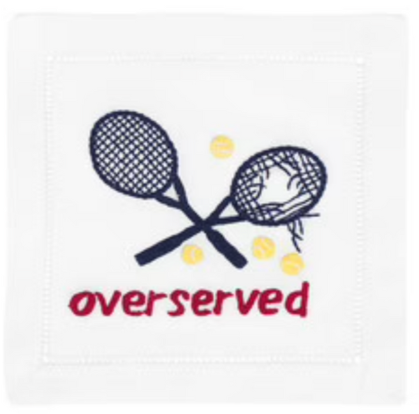 Two crossed tennis rackets with a broken string pattern on a August Morgan Cocktail Napkins Overserved Blue napkin, accompanied by the word "overserved" in red text.
