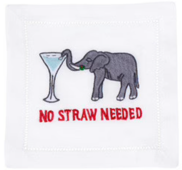 Embroidered image on a white linen August Morgan Cocktail Napkin featuring an elephant next to a martini glass, with the phrase "no straw needed" in red letters.