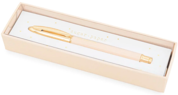 Signature Pen in a light pink box labeled "Sugar Paper" with a white cushioned interior featuring gold polka dots.