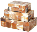 The Global Views Sierra Horn Small Box, measuring 7.25"L x 5.25"W x 2.5"H, is stacked with two other boxes in varying sizes, all featuring a brown and beige checkered pattern.