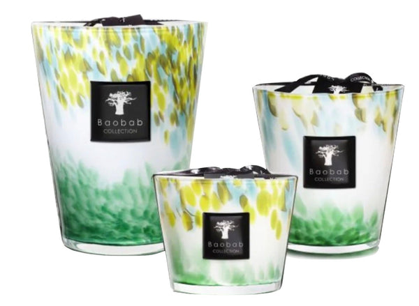 Three decorative scented candles from the Baobab Eden Forest Candle Collection, each in hand-blown opalescent glass containers of varying sizes.