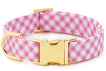 A pink and white checked Foggy Dog fabric dog collar with luxe gold hardware, designed to fit various neck sizes.