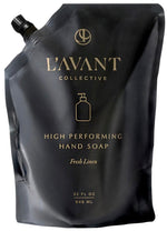 A black refill pouch labeled "L'Avant Collective Hand Soap Refill, Fresh Linen" (32 fl oz/946 mL) with a soap bottle icon and spout cap—features eco-friendly, plant-based hand soap.