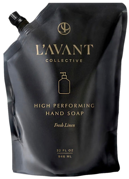 An eco-friendly black flexible pouch labeled "L'AVANT collective L'Avant Hand Soap Refill, Fresh Linen" containing 32 fl oz (946 ml) of liquid soap.