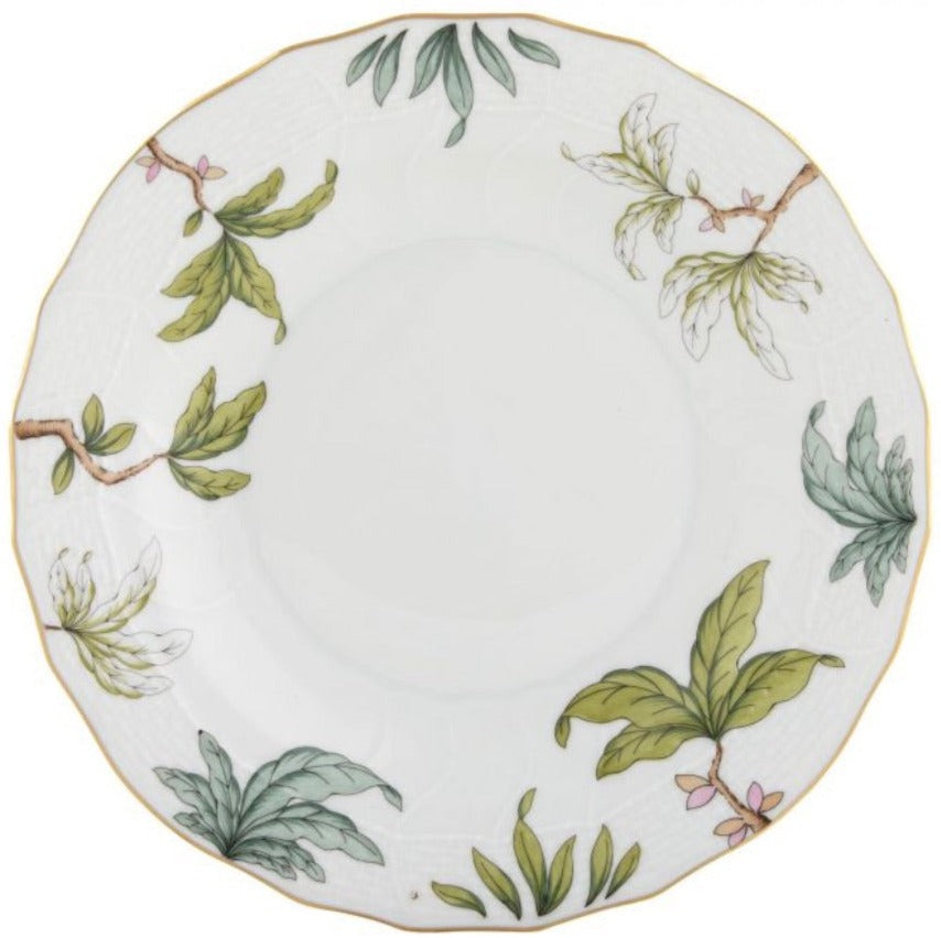 The Herend Foret Garland Collection features a white porcelain plate with a scalloped edge, hand-painted green botanical leaf and branch patterns, and a thin gold rim—an artistic tribute to classic Herend designs.