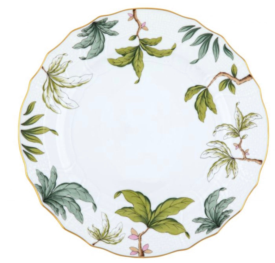 The Foret Garland Collection by Herend features a white ceramic plate with a scalloped gold rim and hand-painted botanical designs of green leaves and brown branches, perfect for artistic appreciation.