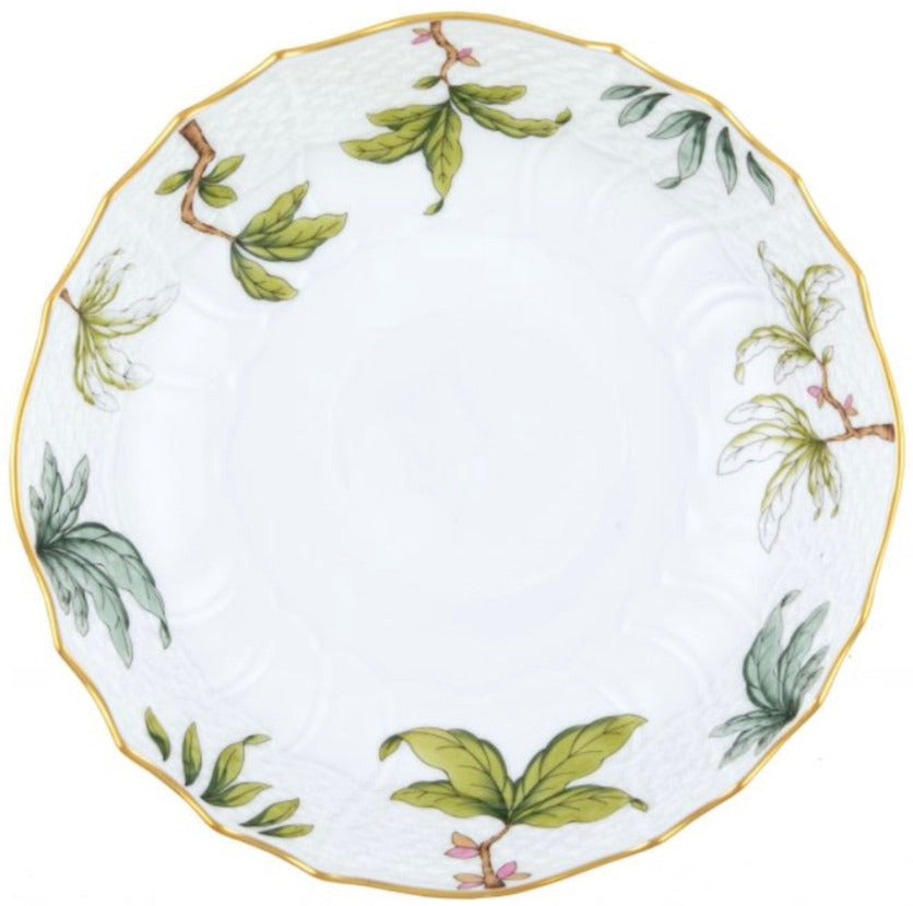 The Herend Foret Garland Collection features a white ceramic plate with a scalloped gold rim and green leaf pattern, highlighted by hand-painted designs ideal for artistic appreciation.