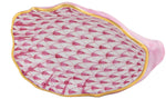 The Herend Oyster Shell is a porcelain dish shaped like a seashell, adorned with the brand’s signature pink fishnet pattern and finished with a gold rim—a hand-painted work of art.