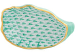 The Herend Oyster Shell is a green and white porcelain dish featuring a scallop shell shape, fish scale pattern, and gold-trimmed edge, presented against a white background.