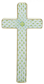 The Herend Cross features a repeating green and white leaf pattern and elegant gold-trimmed edges, inspired by classic Herend porcelain design.