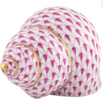 The Herend Periwinkle Shell is a porcelain seashell figurine with hand-painted pink fish scale designs and gold accents, ideal for artistic display, shown on a white background.