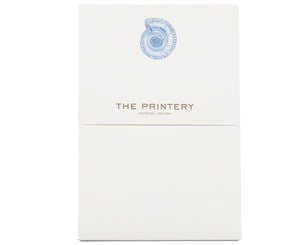 The Nautilus Notepad by Printery features a bone white pad with a blue Nautilus graphic at the top and "THE PRINTERY OYSTER BAY · NEW YORK" in gold at the center. Includes 50 sheets.