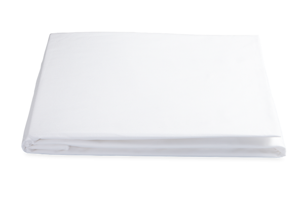 A neatly folded Matouk Sierra Fitted Sheet in White, made from long staple cotton, isolated on a black background.