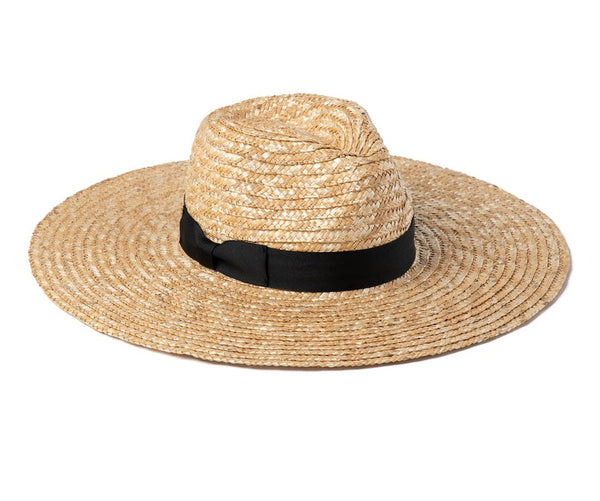 A Lack of Color Spencer Wide Brimmed Fedora in Natural/Black with a black ribbon, isolated on a white background.