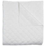 The Layla White Bedding Collection by John Robshaw features a hand quilted cotton voile quilt with a subtle geometric stitched pattern, folded at one corner to display both the front and back.